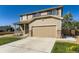 Beautiful home showcasing a well-manicured lawn and a spacious two-car garage at 5090 Miriam Ln, Parker, CO 80134