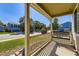 Cozy front porch featuring a swing, landscaping, and inviting curb appeal at 5090 Miriam Ln, Parker, CO 80134
