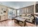 Cozy living room with hardwood floors, a comfortable sofa, and natural light at 5090 Miriam Ln, Parker, CO 80134