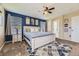 Spacious main bedroom boasts neutral walls, ceiling fan, large windows and a decorative rug at 5090 Miriam Ln, Parker, CO 80134