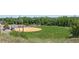 A well-maintained baseball field is visible, surrounded by lush greenery and offering recreational opportunities for residents at 7801 Valley View St, Louviers, CO 80131