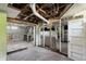 Unfinished basement ready for customization, featuring exposed beams and ductwork at 7801 Valley View St, Louviers, CO 80131