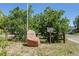 Louviers, Colorado entrance featuring a rock displaying its name with wooden split rail fence, and ample foliage at 7801 Valley View St, Louviers, CO 80131