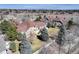 Expansive aerial view of the property showcasing the large, well-maintained lawn and mature trees in a neighborhood at 6068 W Utah Ln, Lakewood, CO 80232