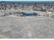 An aerial shot of a pond surrounded by grassland and trees at 6068 W Utah Ln, Lakewood, CO 80232