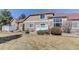 Backyard featuring a well-maintained lawn, and a charming exterior with a white lattice fence at 6068 W Utah Ln, Lakewood, CO 80232