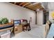 Unfinished basement with concrete flooring, exposed ceiling, and ample storage space at 6068 W Utah Ln, Lakewood, CO 80232