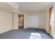 Large basement space featuring neutral paint, carpeting, recessed lighting and access to a bathroom at 6068 W Utah Ln, Lakewood, CO 80232