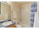 Bathroom featuring a shower over tub combination and vanity with blue countertop at 6068 W Utah Ln, Lakewood, CO 80232