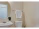 Powder room features modern sink and toilet at 6068 W Utah Ln, Lakewood, CO 80232