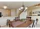 Dining area with neutral walls and flooring adjacent to the kitchen area in an open floor plan at 6068 W Utah Ln, Lakewood, CO 80232