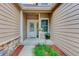 Inviting front entrance with well-maintained landscaping and a charming front door at 6068 W Utah Ln, Lakewood, CO 80232