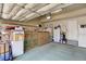 Well-organized garage with shelving, storage boxes, and ample space for vehicles and projects at 6068 W Utah Ln, Lakewood, CO 80232