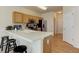 Bright kitchen with stainless steel appliances and a breakfast bar at 6068 W Utah Ln, Lakewood, CO 80232