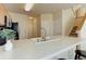 Kitchen with countertop seating and an undermount sink at 6068 W Utah Ln, Lakewood, CO 80232