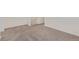 View of finished basement showcasing neutral carpet and white trim at 21821 E 7Th Ave, Aurora, CO 80018