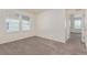 Bedroom features neutral carpet, and a window allowing natural light into the room at 21821 E 7Th Ave, Aurora, CO 80018