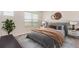 Well-decorated bedroom with bedside tables and lamps, and decorative wall hangings at 21821 E 7Th Ave, Aurora, CO 80018