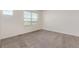 Bright, empty bedroom featuring plush carpeting and a neutral color palette at 21821 E 7Th Ave, Aurora, CO 80018