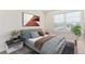 Well-lit bedroom with large window, modern art, and stylish decor at 21821 E 7Th Ave, Aurora, CO 80018