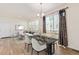 An elegant dining room with sliding glass doors, stylish curtains, and views of the backyard at 21821 E 7Th Ave, Aurora, CO 80018