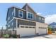 Exterior featuring a two car garage and neutral colored siding at 21821 E 7Th Ave, Aurora, CO 80018