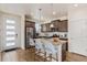 Modern kitchen features stainless steel appliances, granite countertops, and a spacious island with seating at 21821 E 7Th Ave, Aurora, CO 80018