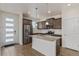 Well-equipped kitchen boasts stainless steel appliances, a central island, and ample cabinet space at 21821 E 7Th Ave, Aurora, CO 80018
