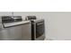 A laundry room featuring modern, front-load washer and dryer at 21821 E 7Th Ave, Aurora, CO 80018