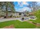 Spacious backyard patio with a built-in grill, dining area, and comfortable seating at 2905 Regis Dr, Boulder, CO 80305
