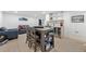 Finished basement boasts a living area with a table and chairs, plus a bar area for entertaining at 2905 Regis Dr, Boulder, CO 80305