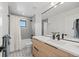 Bright bathroom with subway tile, large mirror, and shower-tub combo at 2905 Regis Dr, Boulder, CO 80305