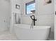 Bright and modern bathroom with free standing tub and modern fixtures at 2905 Regis Dr, Boulder, CO 80305