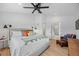 Well lit main bedroom featuring hardwood floors, neutral decor, and ensuite bathroom at 2905 Regis Dr, Boulder, CO 80305