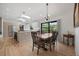 Dining area with hardwood floors, modern lighting, and a view of the backyard at 2905 Regis Dr, Boulder, CO 80305
