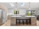Modern kitchen featuring a large island with bar stools, stainless steel appliances, and ample counter space at 2905 Regis Dr, Boulder, CO 80305