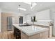Bright kitchen with stainless steel appliances, skylights, gas cooktop, and quartz countertops at 2905 Regis Dr, Boulder, CO 80305
