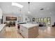 Open floor plan of kitchen into dining and living area featuring an oversized island at 2905 Regis Dr, Boulder, CO 80305