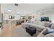 Open-concept living room connected to the kitchen and dining area, skylights, and plenty of seating at 2905 Regis Dr, Boulder, CO 80305