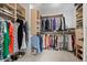 Spacious walk-in closet featuring custom shelving and ample storage for clothes, shoes, and accessories at 2905 Regis Dr, Boulder, CO 80305