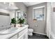 Bright bathroom with modern vanity, decor, and a shower with a decorative curtain at 3778 Happyheart Way, Castle Rock, CO 80109