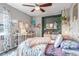 Inviting bedroom with colorful bedding, decor, and cozy ambiance at 3778 Happyheart Way, Castle Rock, CO 80109