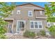 Back exterior view showing the sliding glass door, multiple windows, and neutral siding at 3778 Happyheart Way, Castle Rock, CO 80109