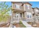 Charming two-story home with stone accents, covered porch, and landscaped front yard at 3778 Happyheart Way, Castle Rock, CO 80109