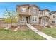 Attractive home with a nicely landscaped yard and inviting front porch at 3778 Happyheart Way, Castle Rock, CO 80109