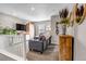 Cozy loft area with a gray couch, TV, and stylish decor at 3778 Happyheart Way, Castle Rock, CO 80109