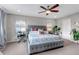 Stylish main bedroom featuring neutral colors, large windows, and modern amenities at 3778 Happyheart Way, Castle Rock, CO 80109