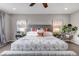 Nicely decorated main bedroom with plants, lamps, and modern artwork at 3778 Happyheart Way, Castle Rock, CO 80109