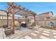 Outdoor patio area with pergola, comfortable seating, and a fire pit, great for entertaining at 3778 Happyheart Way, Castle Rock, CO 80109