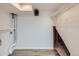 Unfinished basement with shelving, utility access and open area at 6010 S Garland Way, Littleton, CO 80123